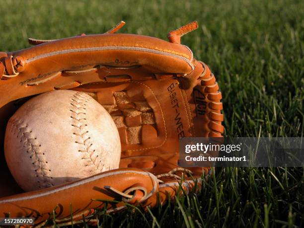 baseball glove holding softball - yankees home run stock pictures, royalty-free photos & images