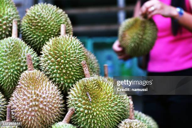 asian market 1: durians in singapore - durian singapore stock pictures, royalty-free photos & images
