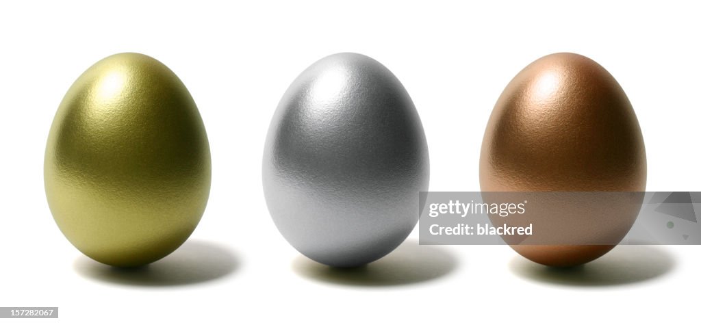 Gold Silver and Bronze Eggs on White Background