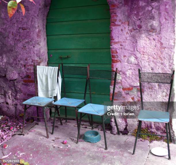 purple house & 4 chairs. - italy purple flowers village stock pictures, royalty-free photos & images