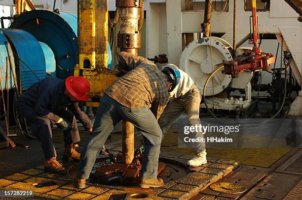 making a connection - oil rig worker bildbanksfoton och bilder