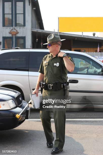 state trooper full body - police hat stock pictures, royalty-free photos & images