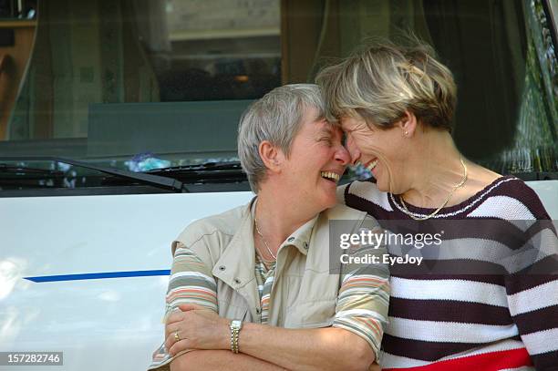 friends - gay seniors stock pictures, royalty-free photos & images