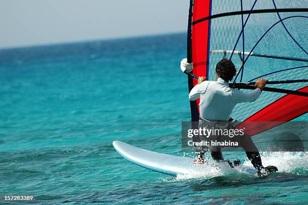 wind surfer - wind surfing stock pictures, royalty-free photos & images