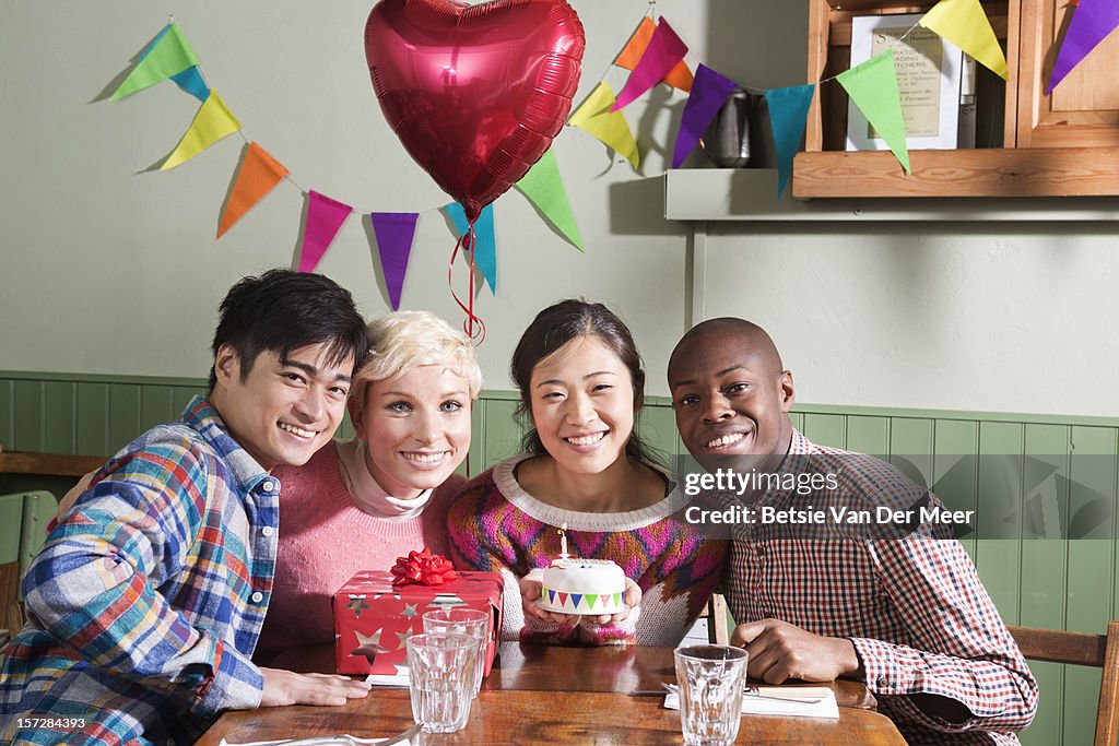 Groups of friends posing with birthday girl.