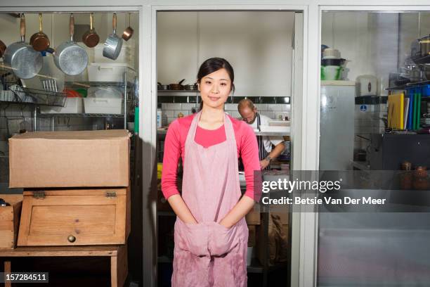 chef in front of commercial kitchen. - incidental people stock pictures, royalty-free photos & images