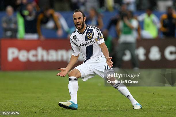 Landon Donovan of Los Angeles Galaxy reacts after scoring on a penalty kick in the second half against the Houston Dynamo in the 2012 MLS Cup at The...