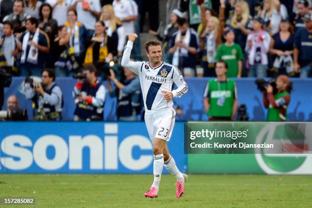 David Beckham of Los Angeles Galaxy celebrates after teammate Omar Gonzalez scores a second half goal against the Houston Dynamo in the 2012 MLS Cup...