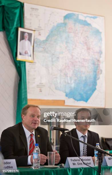 German Development Minister Dirk Niebel and Pascal Kober , German MP, FDP, talk to NGO's at Silveira House on December 1, 2012 in Chishawasha,...