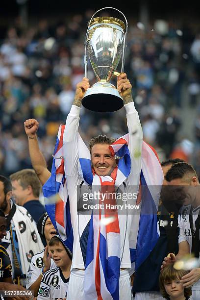 David Beckham of Los Angeles Galaxy celebrates the 3-1 victory against the Houston Dynamo to win the 2012 MLS Cup at The Home Depot Center on...
