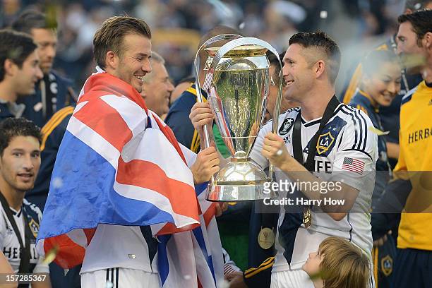 David Beckham and Robbie Keane of Los Angeles Galaxy celebrate the 3-1 victory against the Houston Dynamo to win the 2012 MLS Cup at The Home Depot...