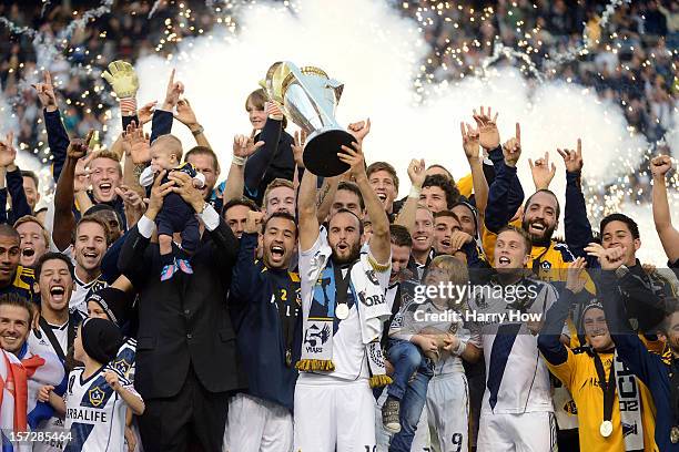 Head coach Bruce Arena and Landon Donovan of Los Angeles Galaxy celebrate the 3-1 victory against the Houston Dynamo to win the 2012 MLS Cup at The...