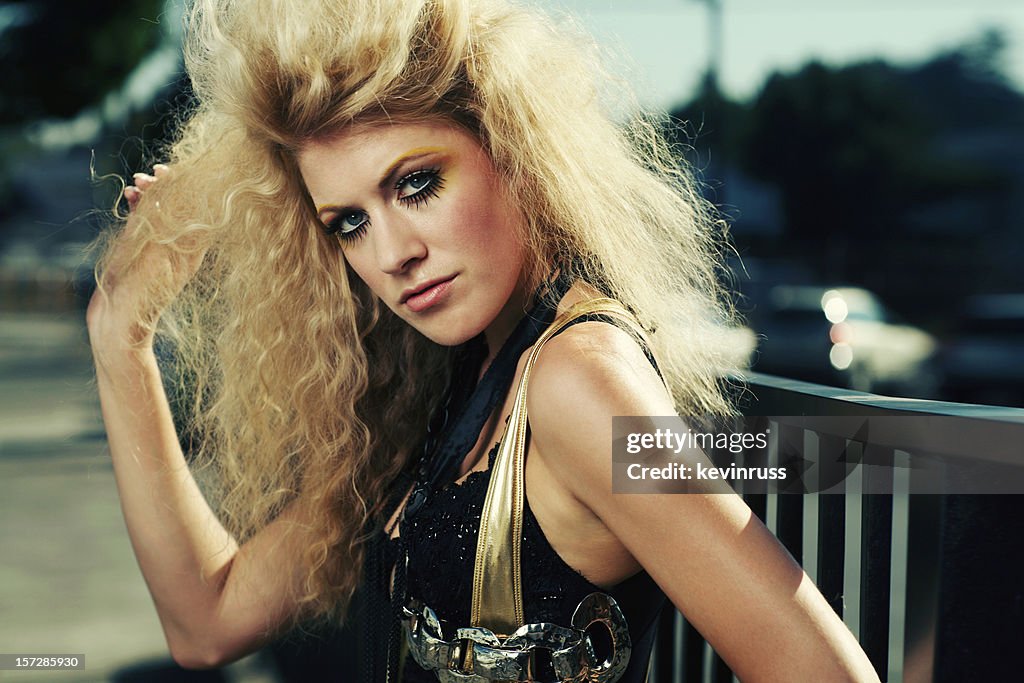 Retro Big Hair Blonde in Gold and Black Outfit