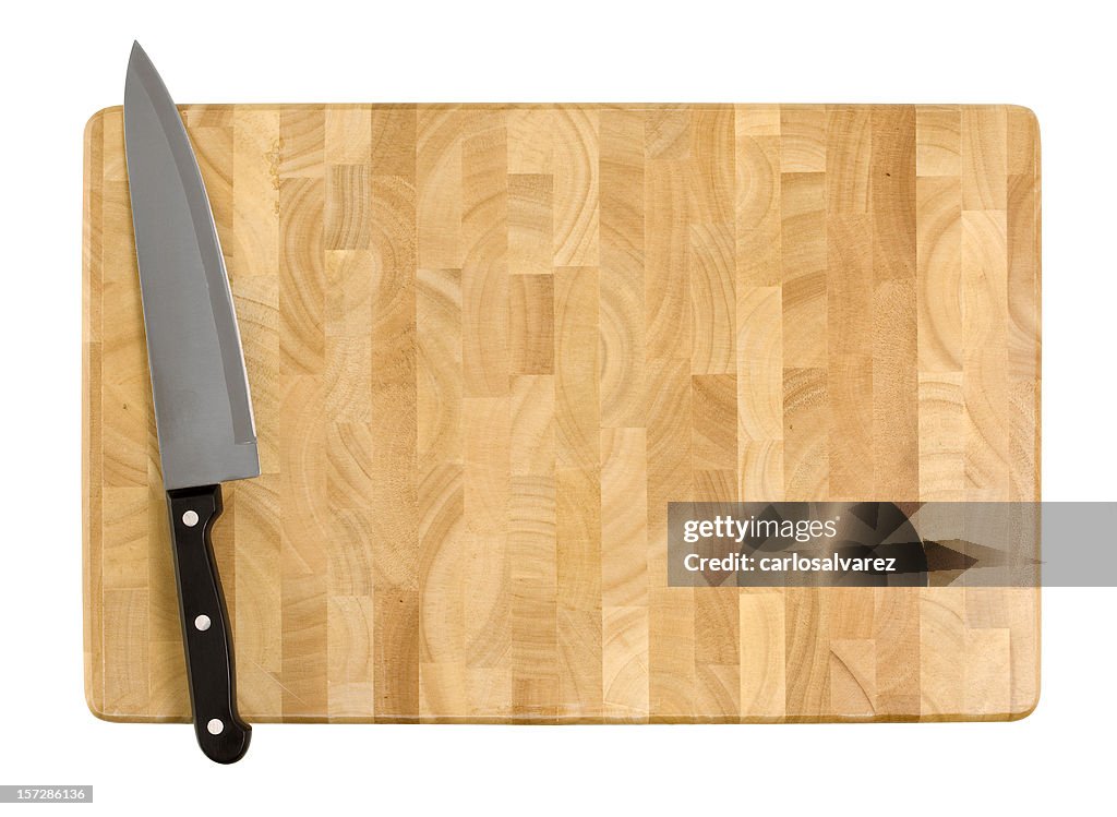 Kitchen knife on a wooden cutting board