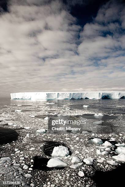 dramatic melting iceberg - icecap stock pictures, royalty-free photos & images