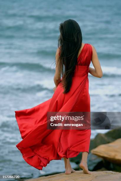 redwoman - red dress photos et images de collection