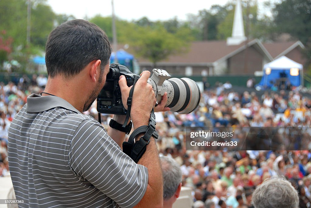Photojournalist and Crowd of People