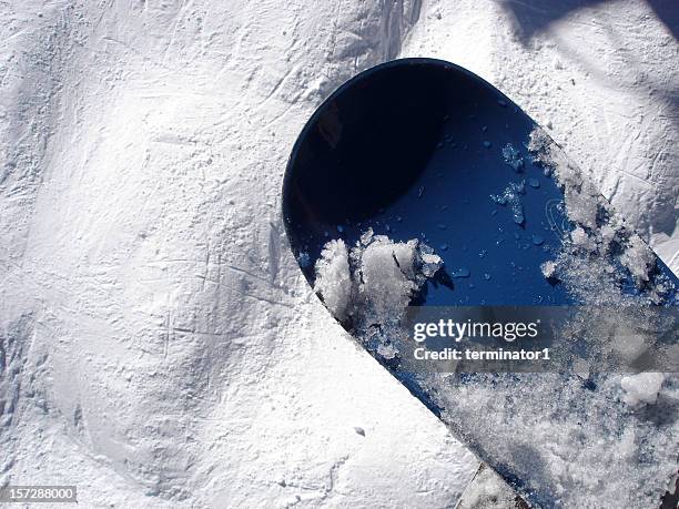 blue snowboard on bump run - slushy texture stock pictures, royalty-free photos & images