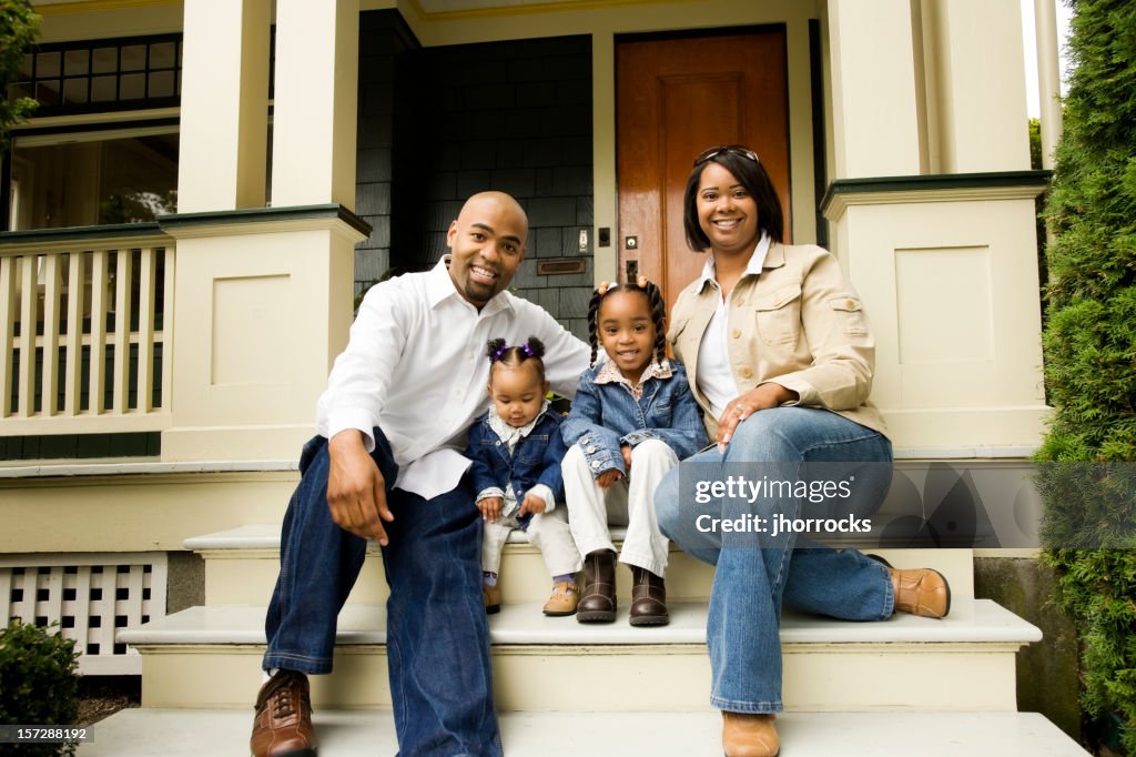 Young Family of Four at Home