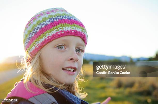 little girl in winter hat on a rural walk - canterbury plains stock pictures, royalty-free photos & images