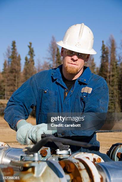 oilfield worker - oil well stock pictures, royalty-free photos & images