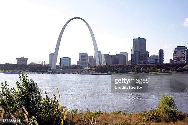 skyline of st louis by a river - missouri skyline stock pictures, royalty-free photos & images