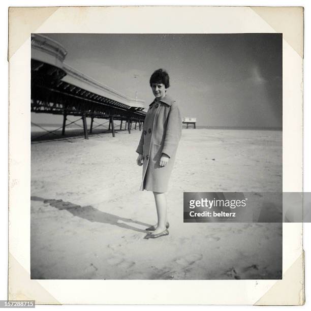 vintage beach shot - grey pier stockfoto's en -beelden
