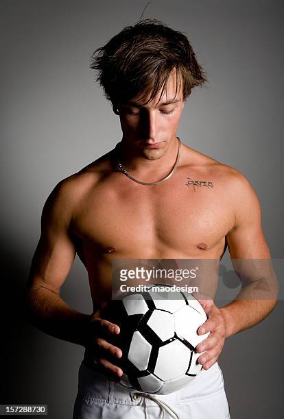 young guy with soccer ball - football player face stock pictures, royalty-free photos & images