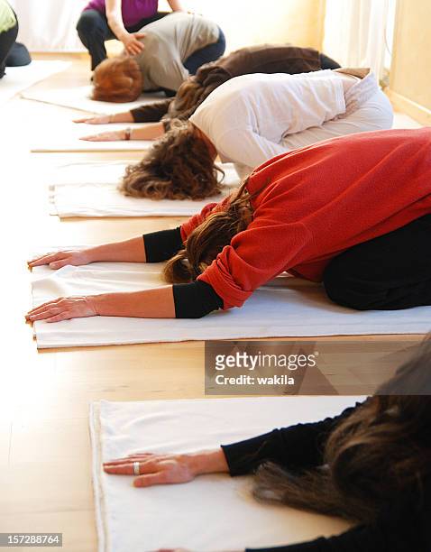 german causacian yogagroup in a row with coaching teacher - pranayama stock pictures, royalty-free photos & images