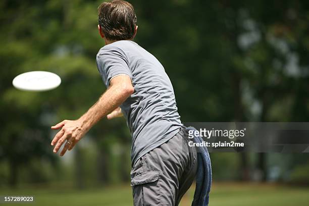 ultimate frisbee - throwing frisbee stock pictures, royalty-free photos & images