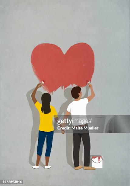 couple holding hands, painting red heart on gray wall - man standing stock illustrations