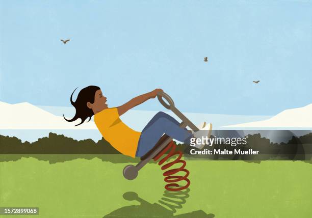 carefree girl playing on spring playground equipment in sunny park - light effect stock illustrations