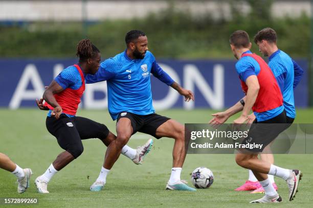 Brandon Thomas-Asante of West Bromwich Albion and Kyle Bartley of West Bromwich Albion go for the ball during a training session at West Bromwich...