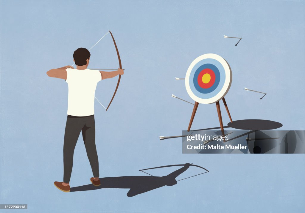 Man with bow shooting arrows at bull's-eye, missing the mark
