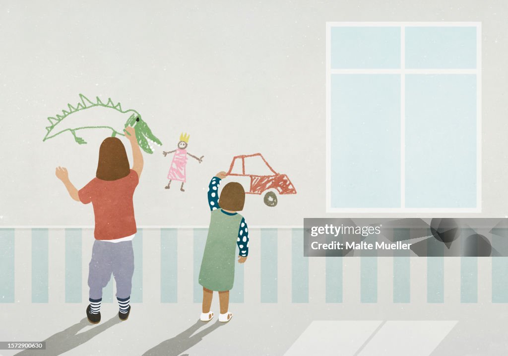 Girls drawing on wall