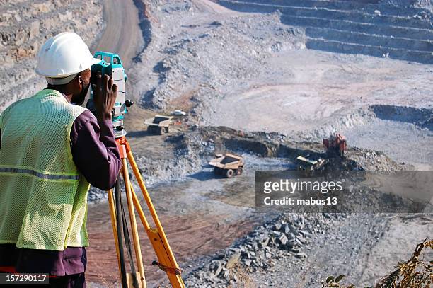 surveying the pit 1 - mining natural resources stock pictures, royalty-free photos & images