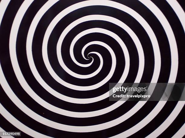 twilight zone spirals - hypnotist stock pictures, royalty-free photos & images