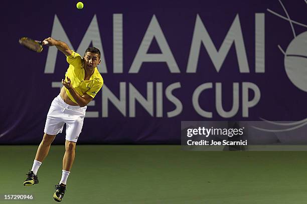 Nicolas Almagro of Spain serves to John Isner of USA during the inaugural Miami Tennis Cup at Crandon Park Tennis Center on December 1, 2012 in Key...