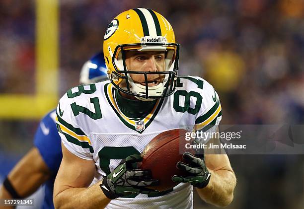 Jordy Nelson of the Green Bay Packers carries a reception in for a touchdown against the New York Giants at MetLife Stadium on November 25, 2012 in...