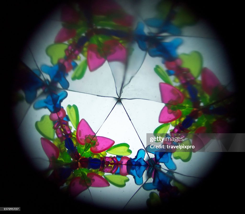 Inside a kaleidoscope, abstract images in blue, green, pink