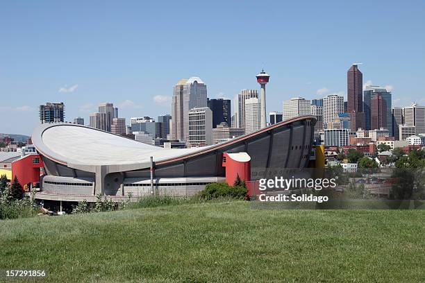 calgary skyline with full saddledome - calgary summer stock pictures, royalty-free photos & images