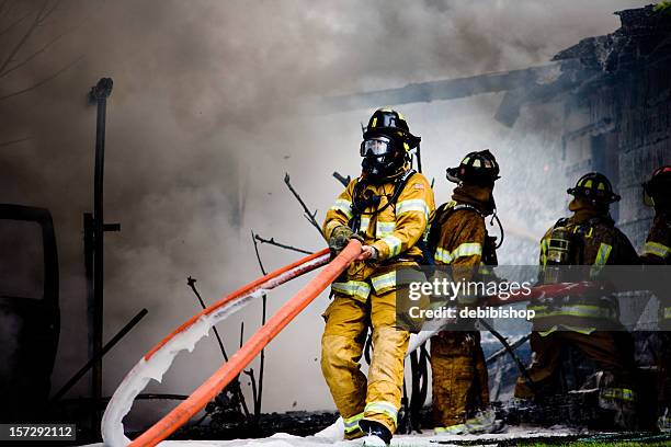 firemen on duty - hose stock pictures, royalty-free photos & images