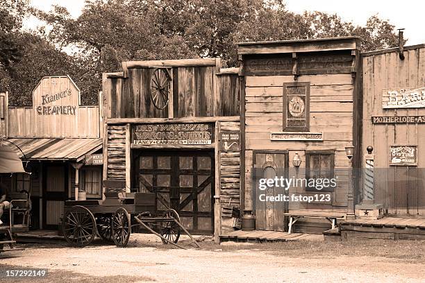 boardwalk in an old western town.  wagon parked front. - barber shop stockfoto's en -beelden