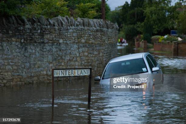 abandoned car in rural flooding - flood stock pictures, royalty-free photos & images