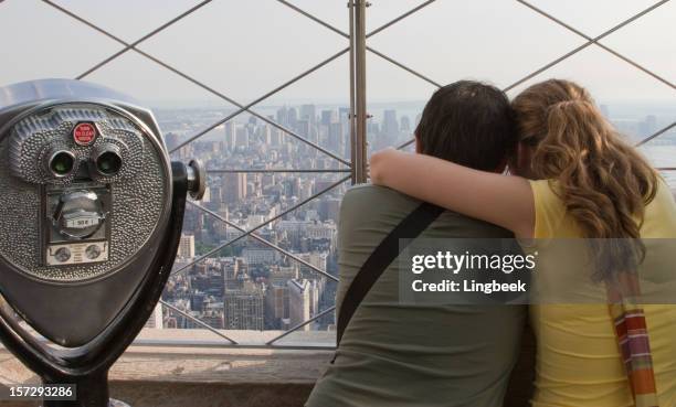 tourists on the empire state building - empire state building stock pictures, royalty-free photos & images