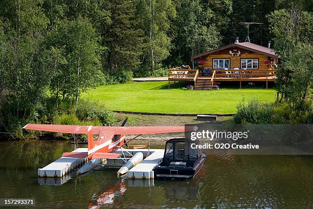 log cabin and floatplane - alaska stock pictures, royalty-free photos & images