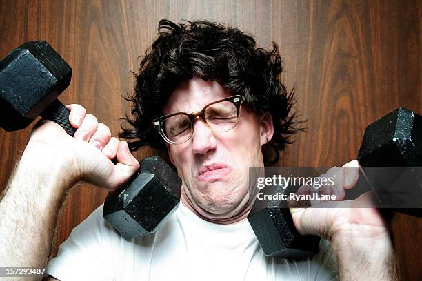 nerd young man exercising / weight lifting - funny fail stock pictures, royalty-free photos & images