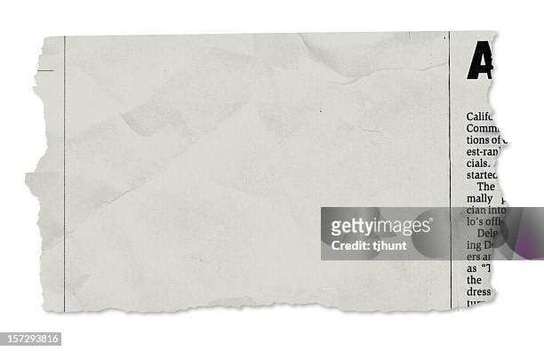 single newspaper tear - on white - part of stockfoto's en -beelden