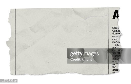 Single newspaper tear - on white Single newspaper tear - on white