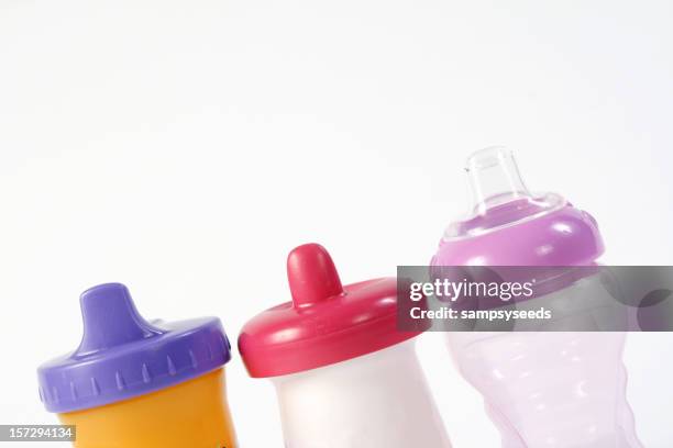 sippy cups - beaker white background stock pictures, royalty-free photos & images